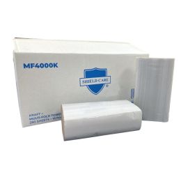 Stacks of kraft multi-fold towels in front of their box.